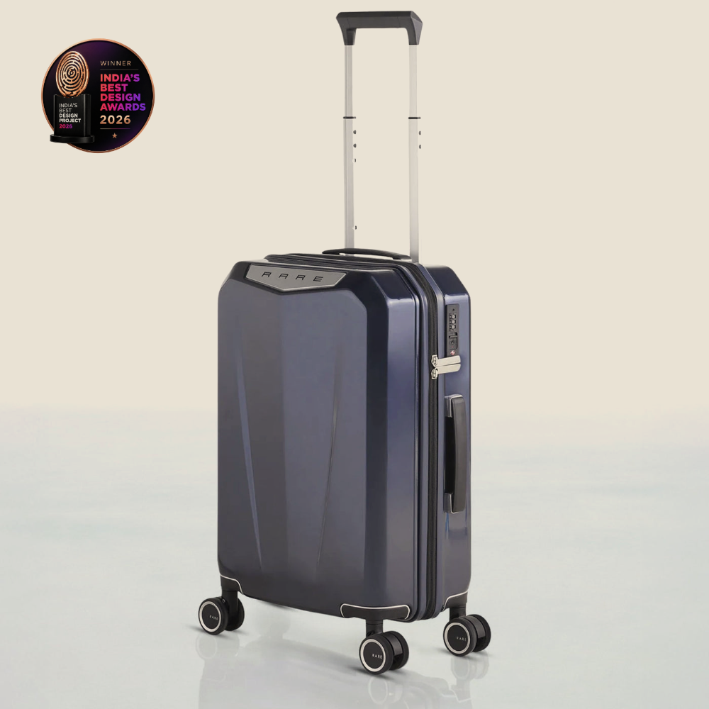 Hard-shell polycarbonate trolley suitcase, dark blue, front corner view with wheels