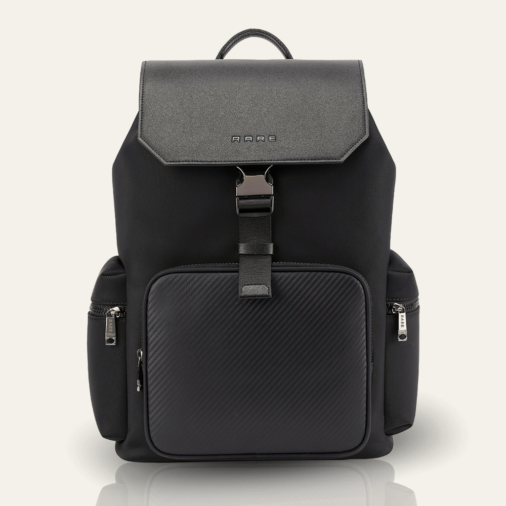 Black backpack with top handle, front zip pocket, and side zipper pulls