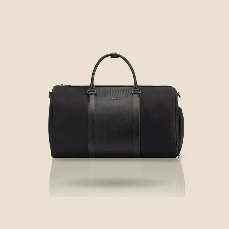 Black duffle bag with two top handles and central strap panel