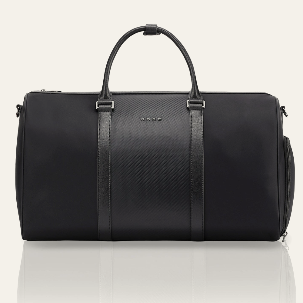 Black duffle bag with textured center panel and top handles