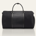 Black duffle bag with textured center panel and top handles