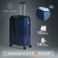 Hard shell trolley suitcase in dark blue, side view with top handle and spinner wheels