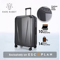 Hard-shell trolley luggage, dark gray carbon fiber finish, angled front-left view