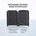Hard-shell polycarbonate trolley suitcase interior with zipped dividers and cross-ribbon strap