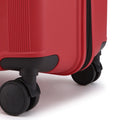 Red large check-in suitcase corner with four spinner wheels and base support.