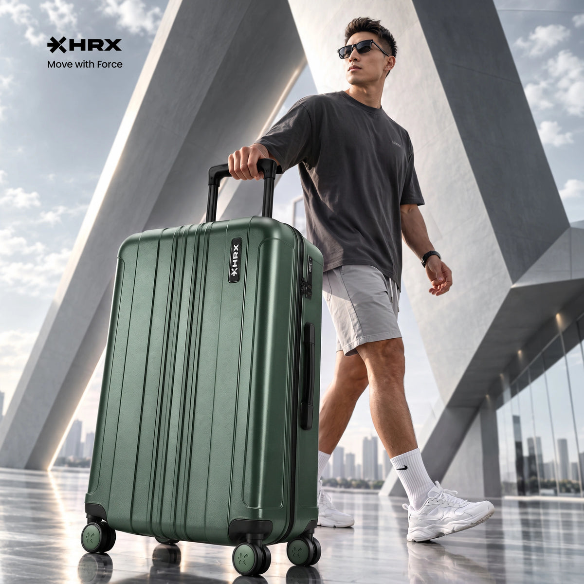 Dark green hard-shell spinner luggage with telescopic handle and four multidirectional wheels.