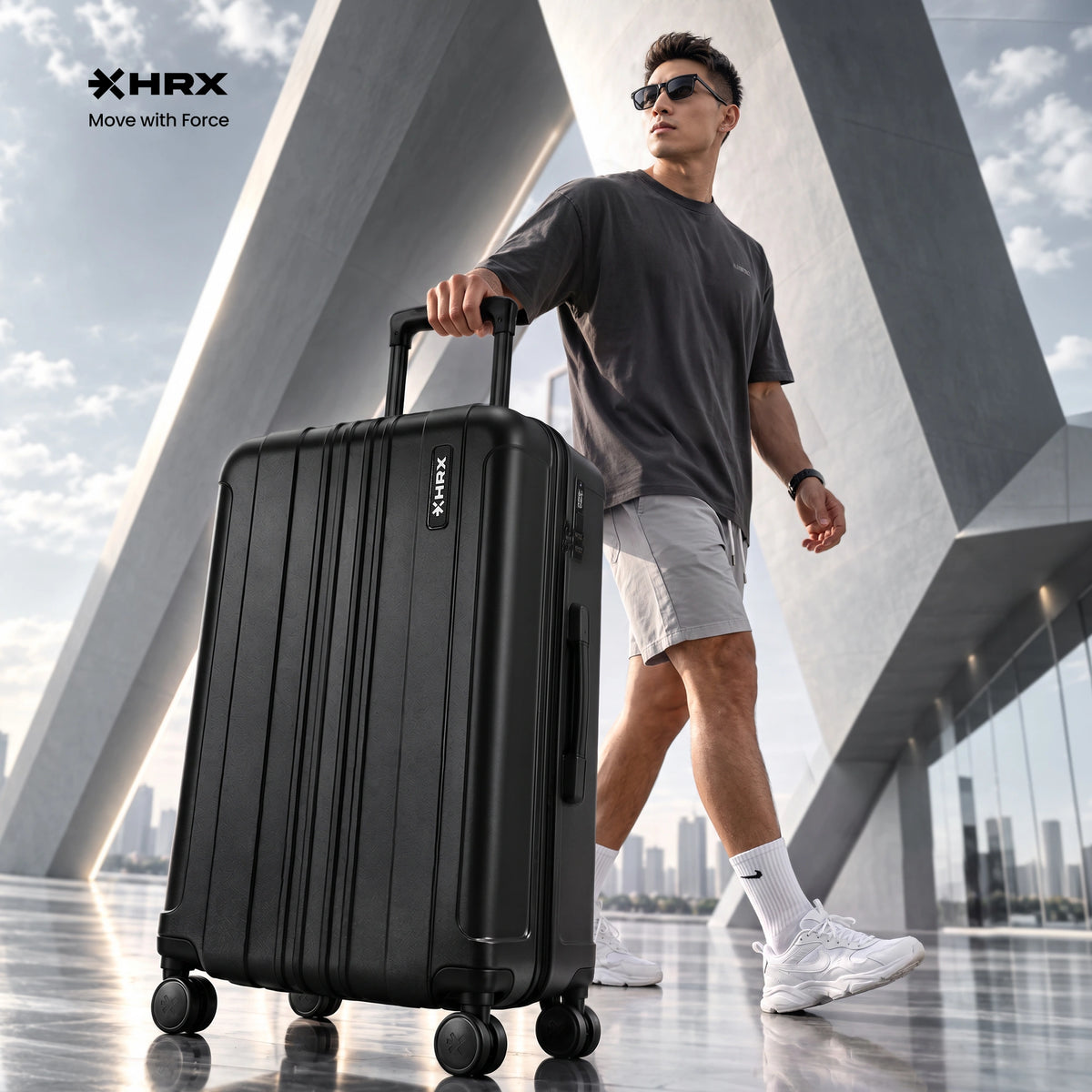 Hard-shell polycarbonate suitcase with telescopic handle and spinner wheels, dark color