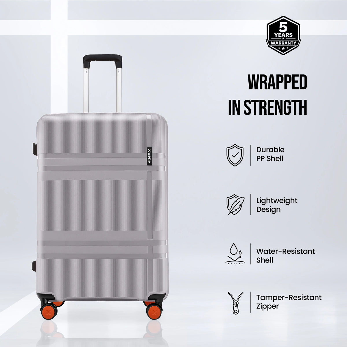 Grey hard-shell suitcase with telescopic handle and four spinner wheels