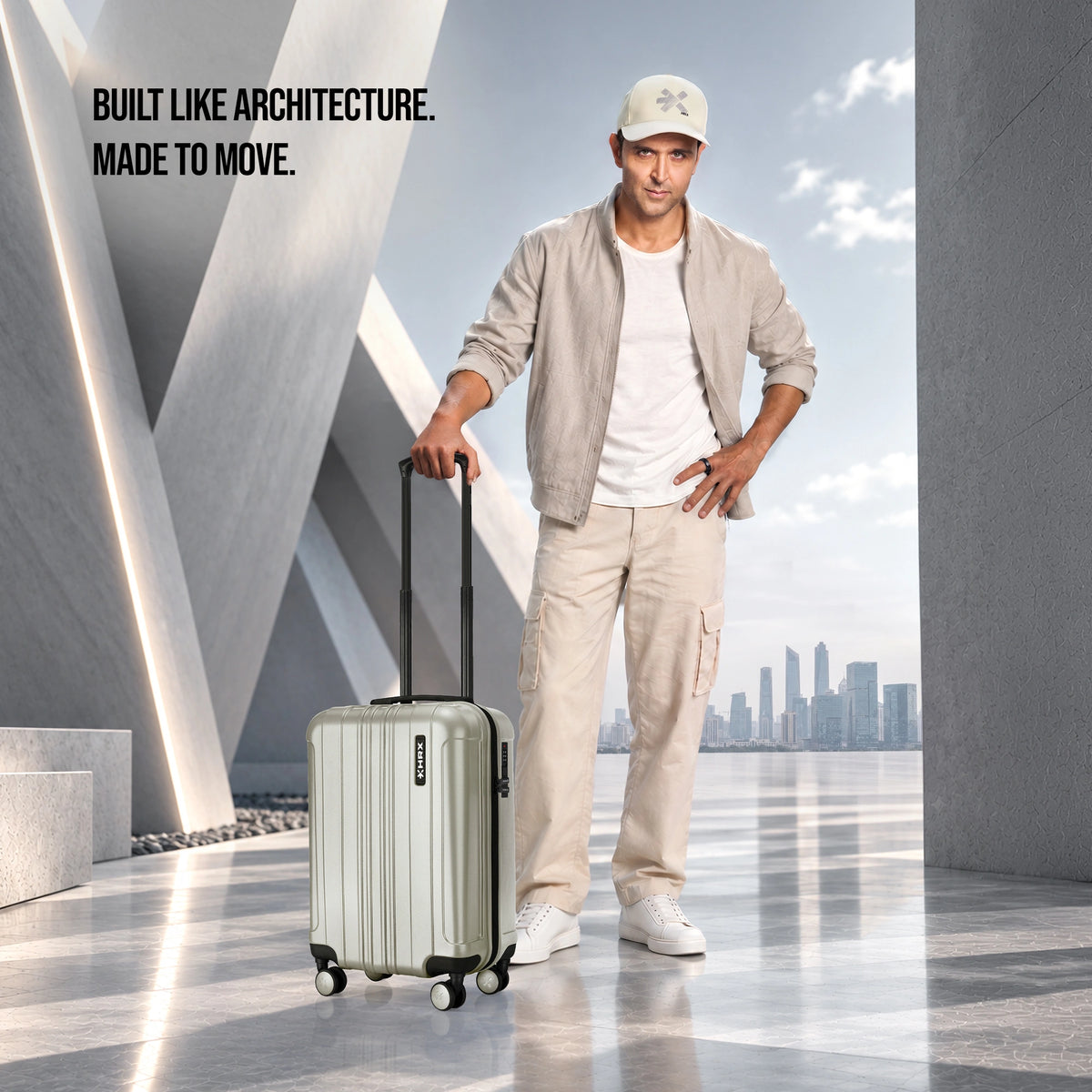 Light silver cabin polycarbonate suitcase with 8 wheels, side handle, and textured shell