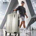 Light silver cabin polycarbonate suitcase with 8 wheels and upright telescopic handle
