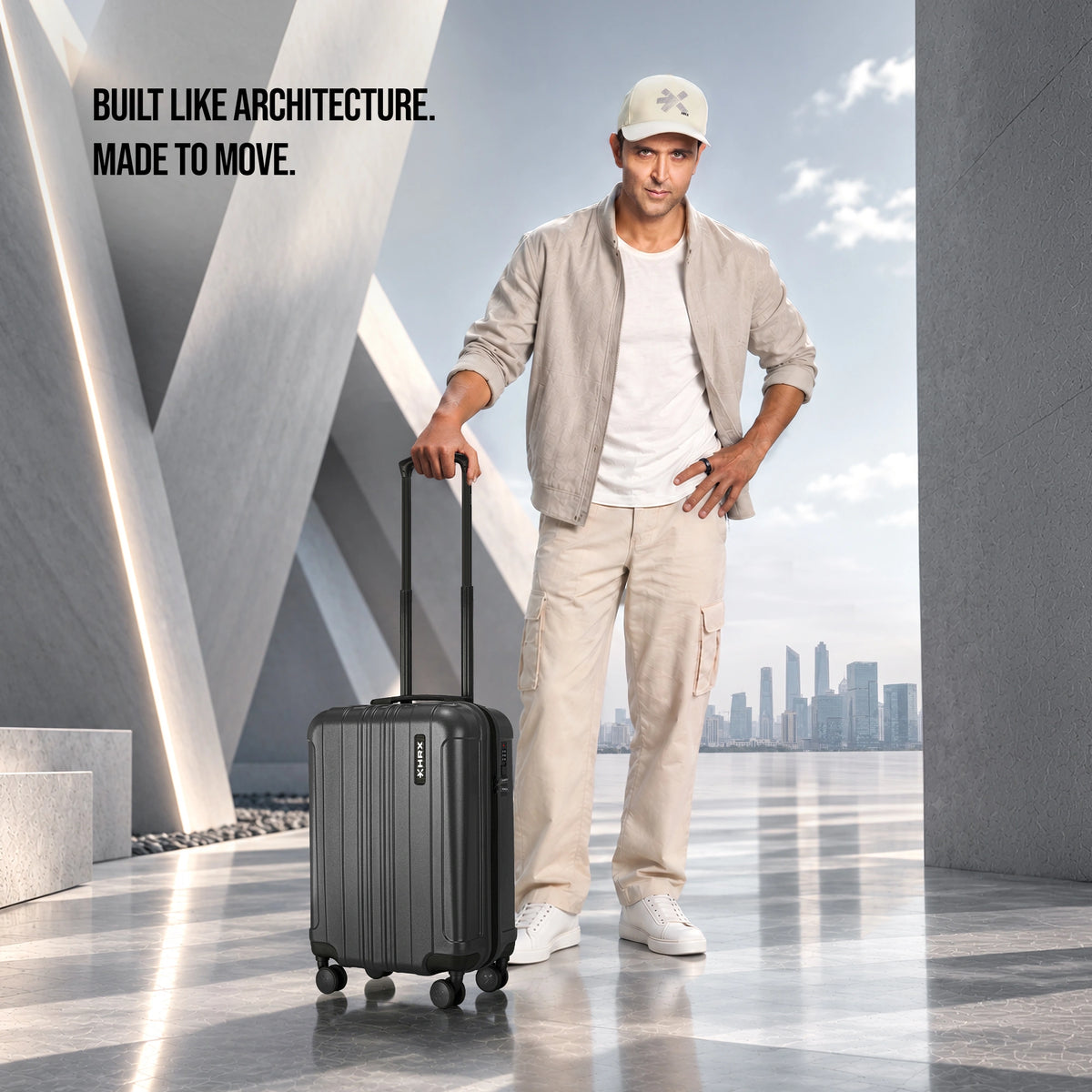 Charcoal gray small cabin suitcase with retractable handle and 8 spinner wheels