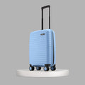 Light blue hard-shell suitcase with telescopic handle and four wheels.