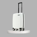 White small cabin suitcase standing upright with four caster wheels and black frame
