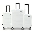 Set of three white cabin suitcases with black handles and wheels, nested side by side