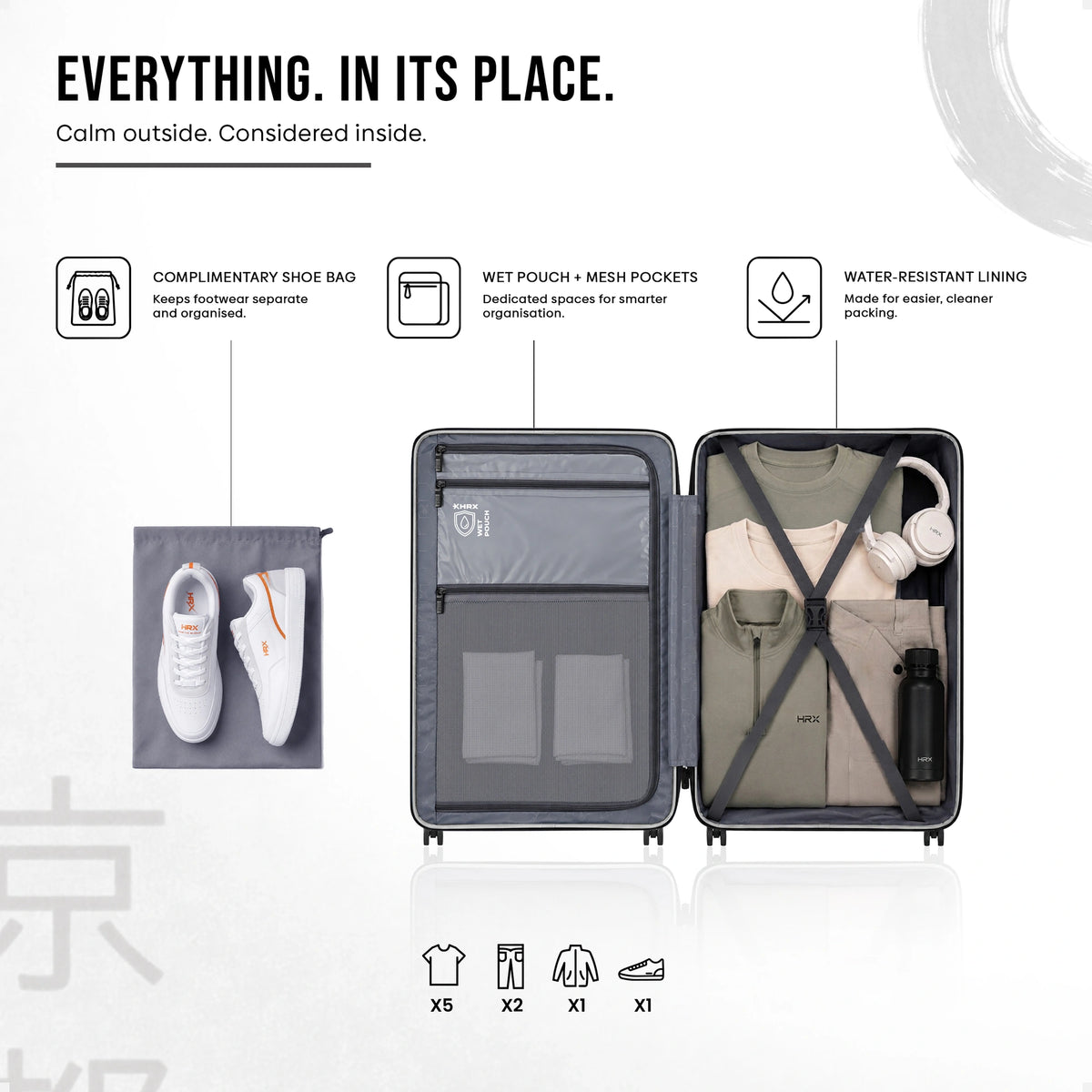 Open white cabin suitcase interior with mesh pockets, divider panels, and cross straps
