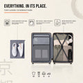 Opened interior of a black-edged luggage shell with compartments and accessories