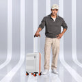 White cabin suitcase with telescopic handle, orange edge trim, and spinner wheels