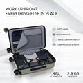 Opened trolley case with grey soft lining, mesh pocket, and compression straps inside.