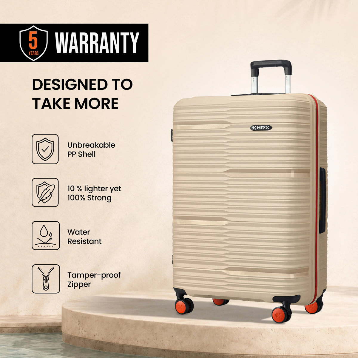 Beige large check-in suitcase on 4 spinner wheels, upright with extended handle
