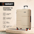 Beige large check-in suitcase on 4 spinner wheels, upright with extended handle