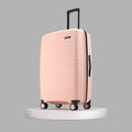 Peach hard-shell cabin luggage with ridged front, zipper side panel and spinner wheels