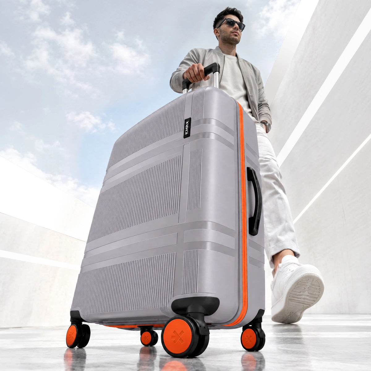 HRX Helium large check-in suitcase, white shell with orange trim and spinner wheels