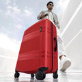 Red polycarbonate check-in suitcase with 8 wheels and extendable trolley handle