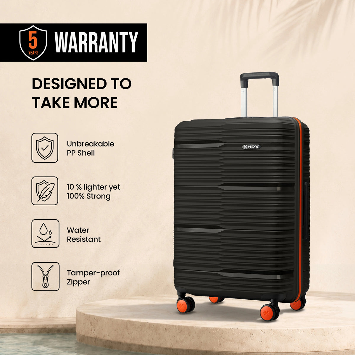 Medium check-in suitcase, black ribbed shell with telescopic handle and orange wheels
