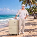 Beige HRX Zanzibar suitcase on sand with telescopic handle and 8 spinner wheels