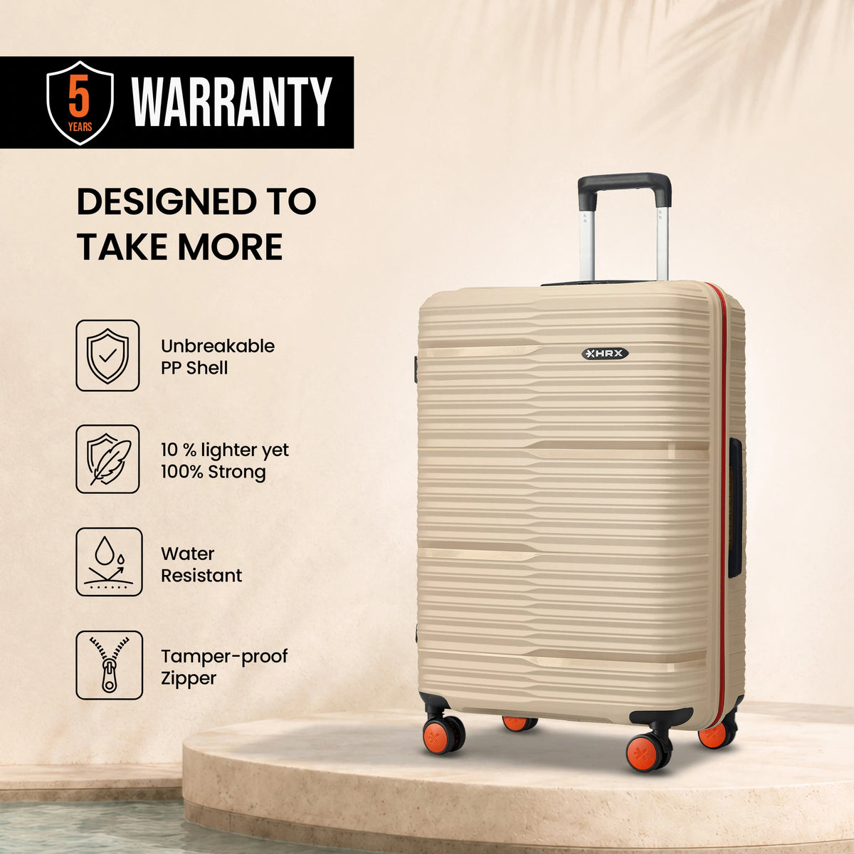 Beige HRX Zanzibar medium check-in suitcase with ribbed shell and orange corner wheels