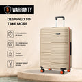Beige HRX Zanzibar medium check-in suitcase with ribbed shell and orange corner wheels