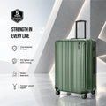 Dark green check-in suitcase with molded shell, upright handle, and spinner wheels