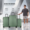 Dark green medium check-in suitcase with upright handle and 4 spinner wheels