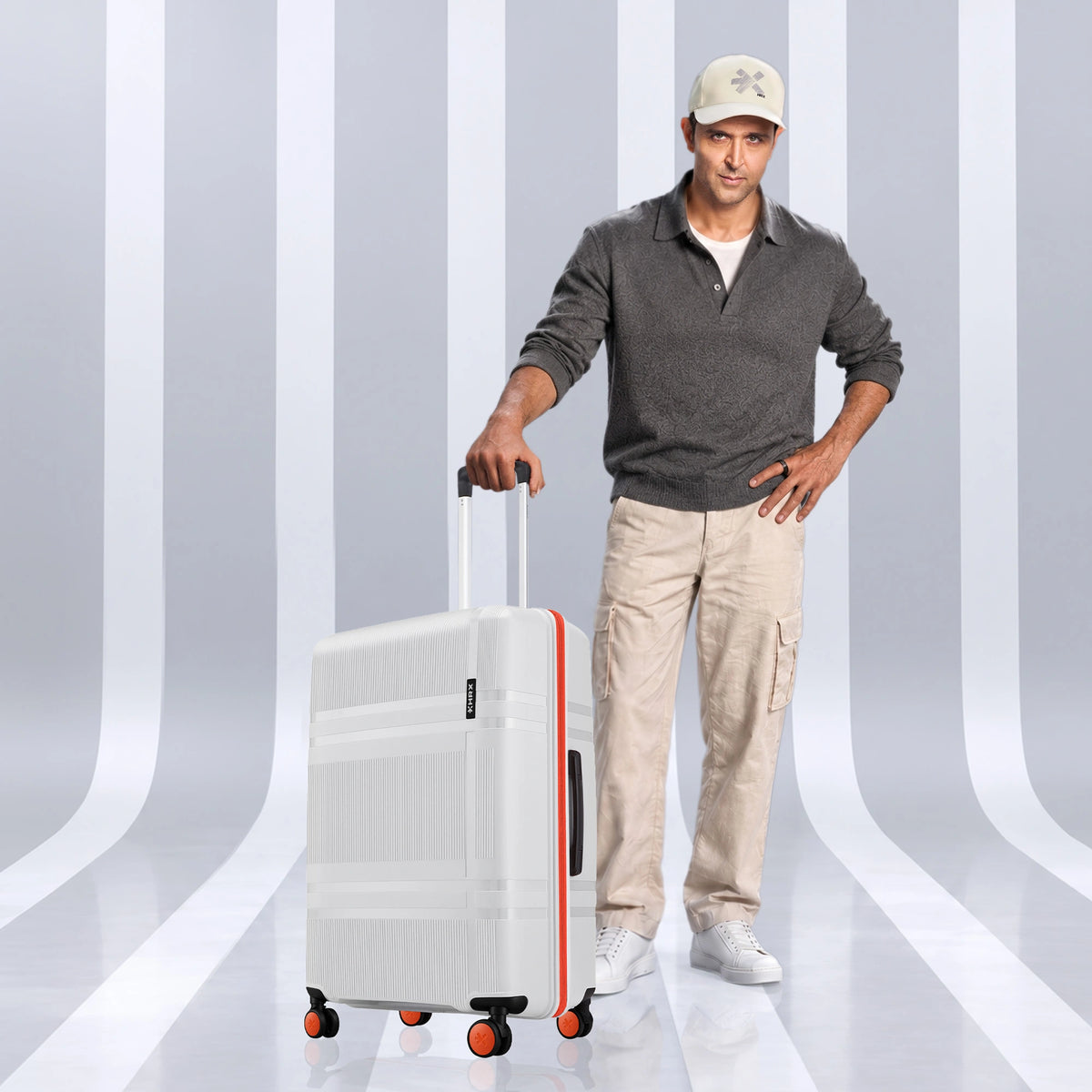 Medium check-in hard-shell suitcase with 8 wheels, upright handle, light grey finish