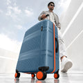 Blue hard-shell suitcase with zippered side pocket and four spinner wheels