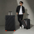 Black hard-shell trolley suitcase with red wheels and side handle, upright view
