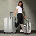 Silver hard-shell large trolley suitcase set with upright handle and spinner wheels