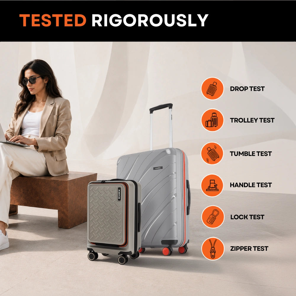 Grey hard-shell medium spinner suitcase with front pocket and telescopic handle