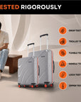 Grey hard-shell rolling suitcases with telescopic handles and red wheel accents