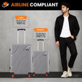Medium and large grey hard-shell rolling suitcases with telescopic handles and red wheels