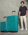 Teal hardshell cabin and large trolley suitcases, telescopic handles, spinner wheels.