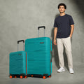 Teal hardshell cabin and large trolley suitcases, telescopic handles, spinner wheels.