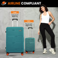 Teal hardshell large and cabin trolley suitcases side by side with telescopic handles.