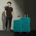 Teal hard-shell upright luggage set with telescopic handle and orange spinner wheels