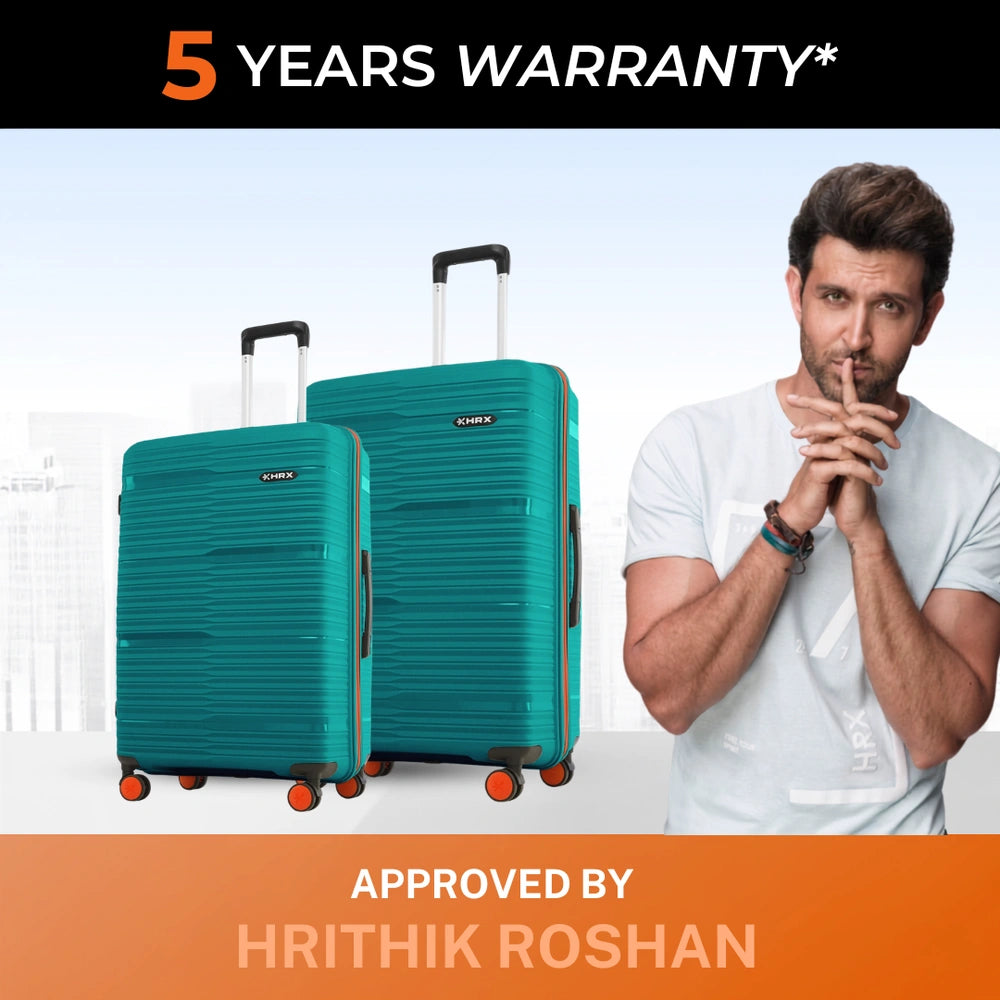 Pair of teal upright hard-shell suitcases with telescopic handles and orange wheels