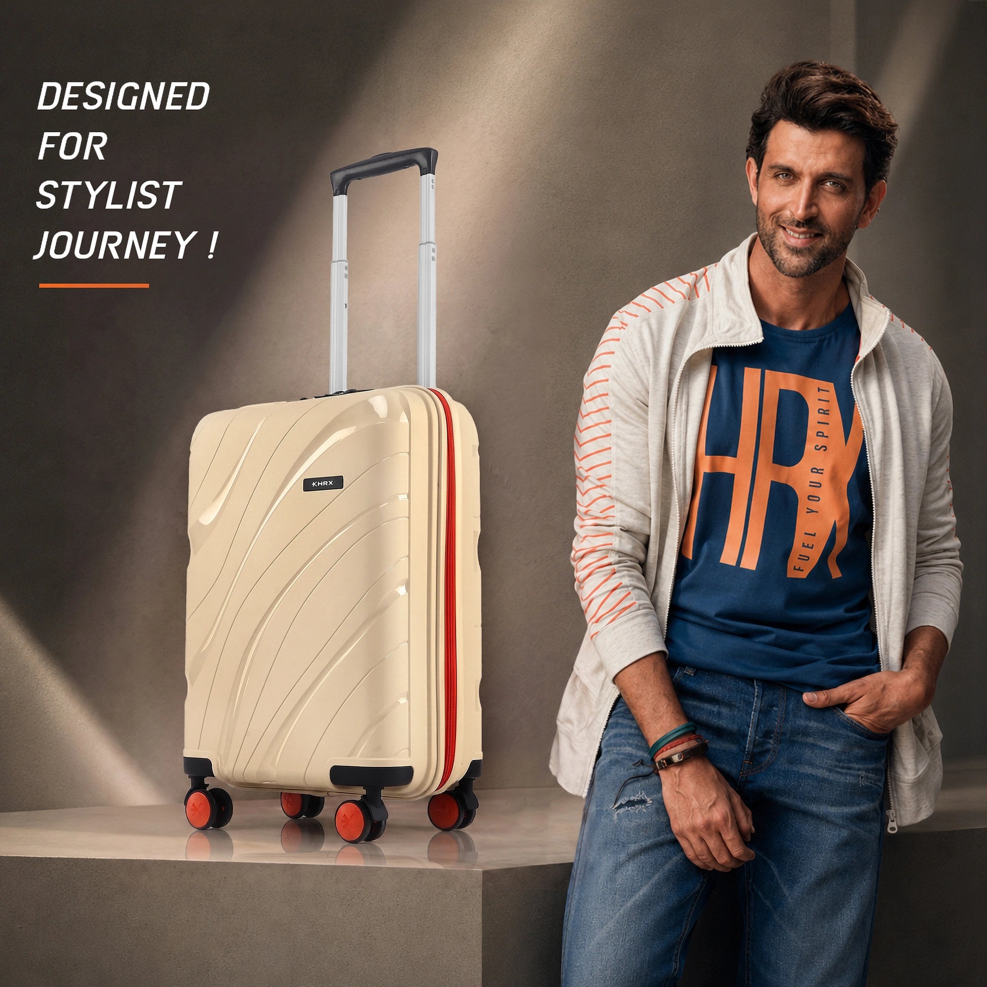 Beige cabin suitcase with telescopic handle, ridged front, and red-accent spinner wheels