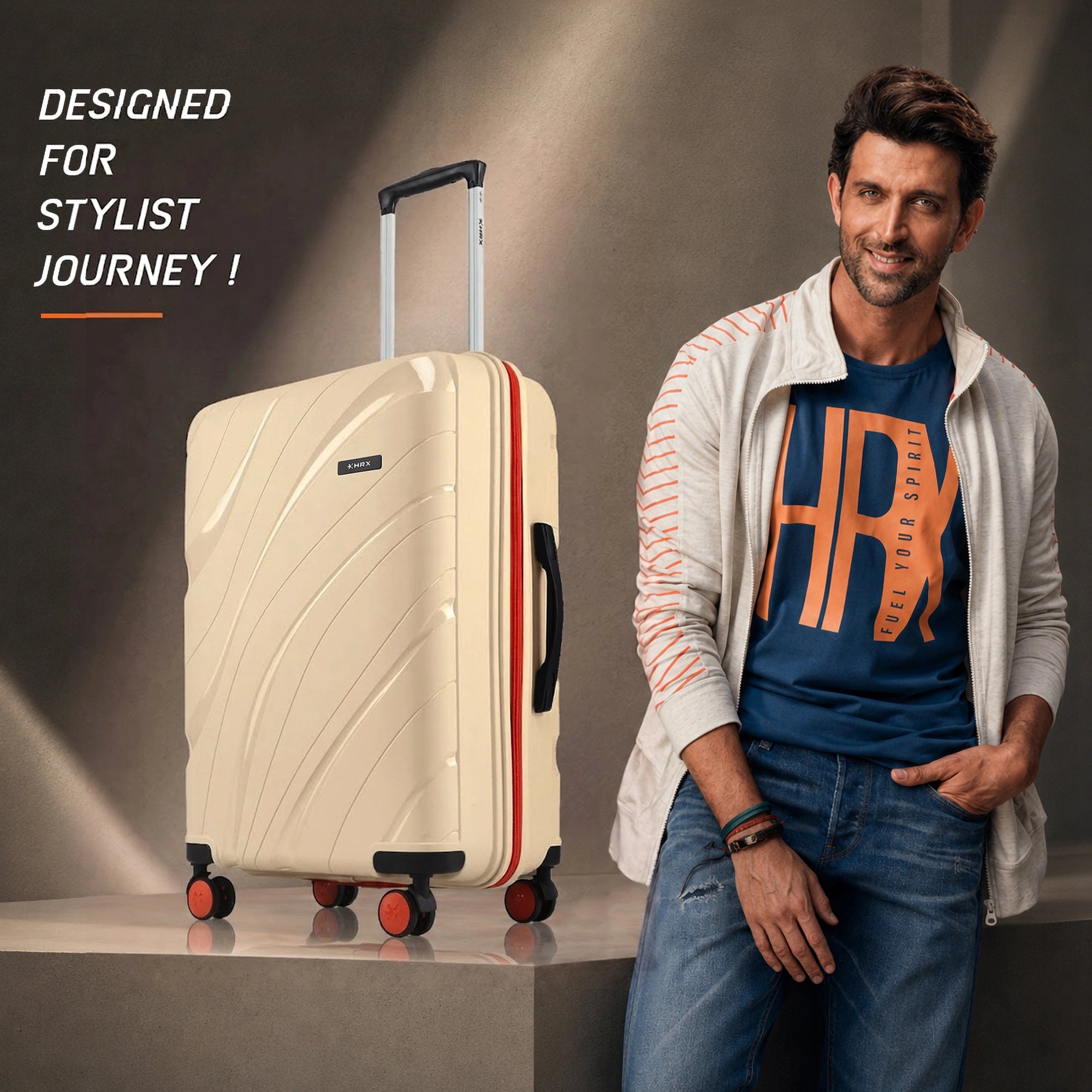 Cream medium check-in suitcase with upright handle, orange-trim wheels, and textured shell.
