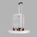 Small cabin suitcase, white shell with red trim, 8-wheel base and upright handle view.
