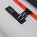 Hard-shell suitcase top strap, gray shell with orange zipper track and HRX label