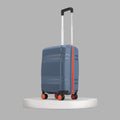 Blue cabin suitcase with telescopic handle, orange wheel accents, and side panel lines